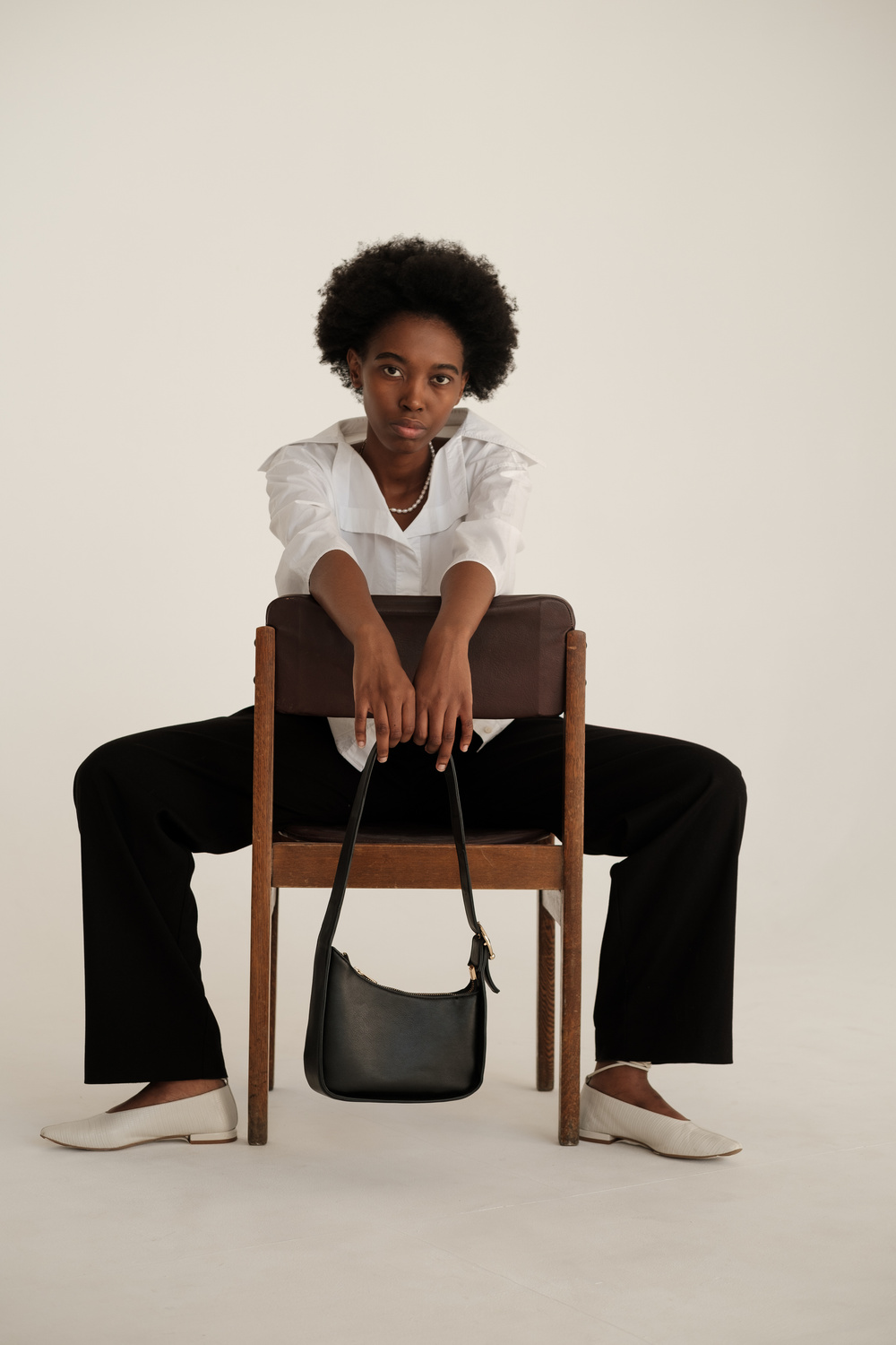 Woman in Casual Dress Shirt and Black Purse